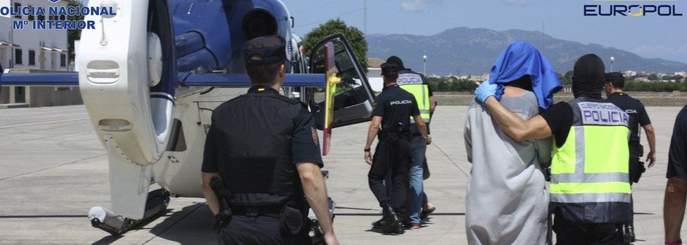 A suspected jihadist is transferred to police custody at Palma de Majorca