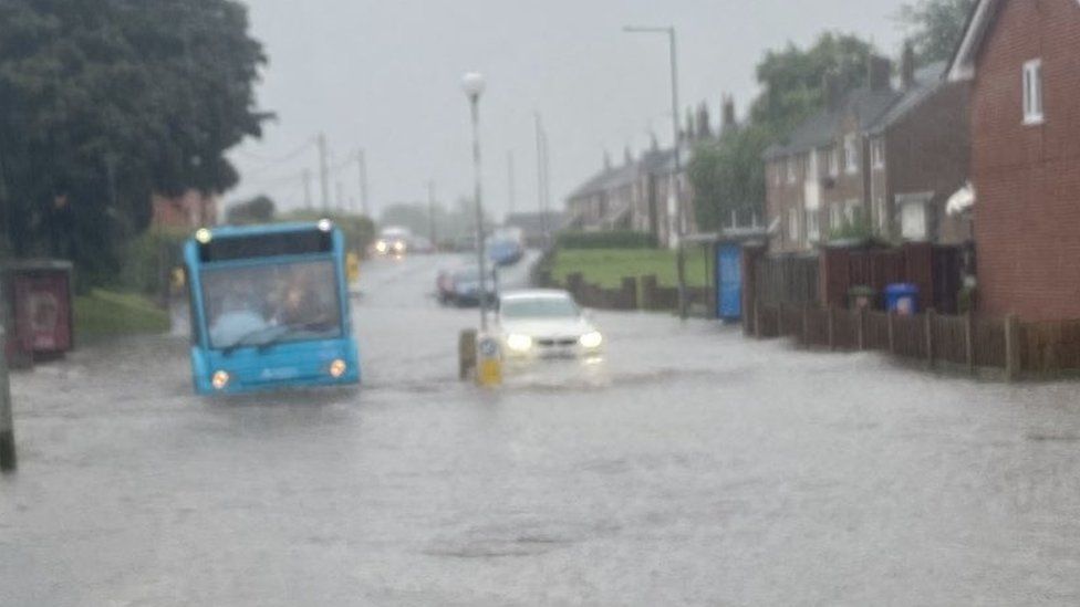 Roads were left under water after heavy rainfall hit parts of Wales