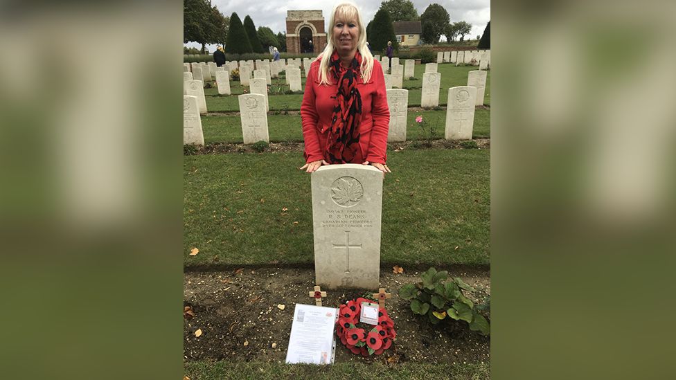 Gwyneth Jones behind grave