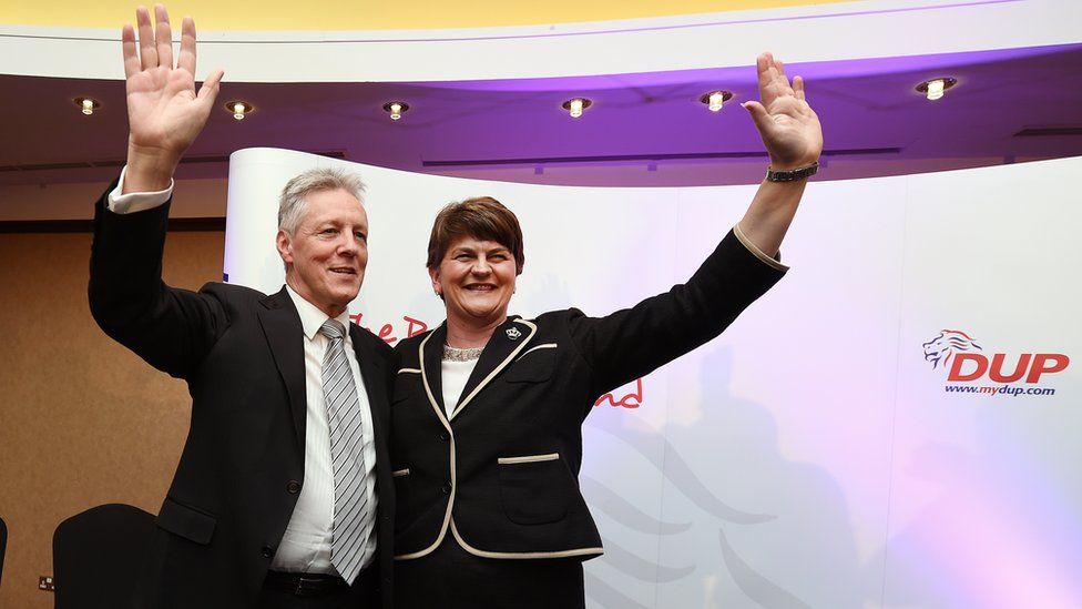 Peter Robinson and Arlene Foster accepts the applause after her speech at the DUP conference in 2015