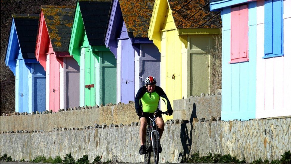 Man riding his bicycle in Folkestone, Kent on 25/2/19
