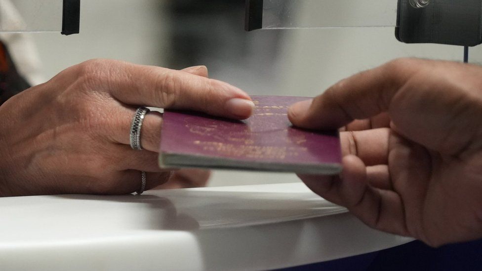 Passport check at UK Border Force check-in desk at Gatwick Airport