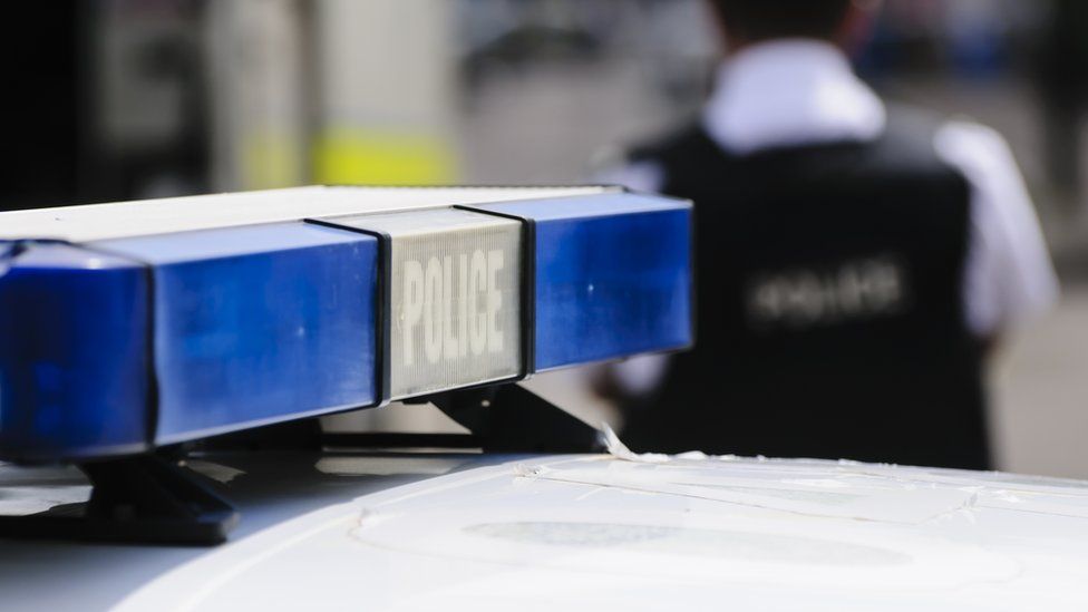 Blue lights on the roof of a police vehicle