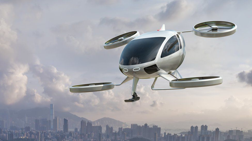 A computerised graphic of an air taxi - which looks a bit like a helicopter