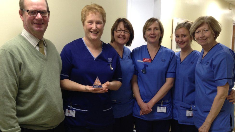 NHS Highland chairman Garry Coutts with the ward GC staff
