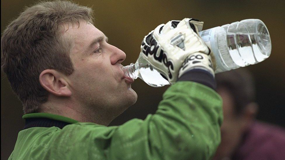 Andy Goram takes a drink of water during a Scotland training session in 1996