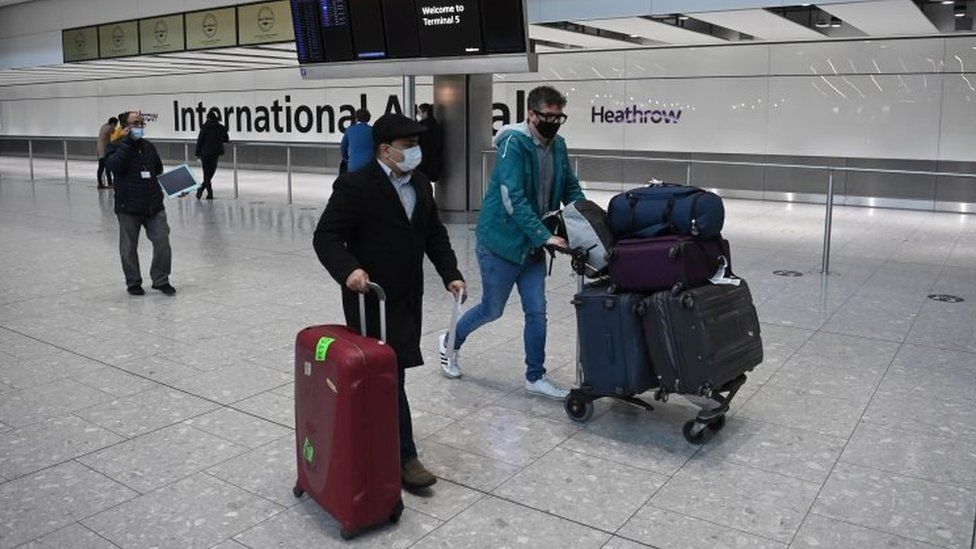 Travellers in the international arrival area of Heathrow Airport on 18 January 2021