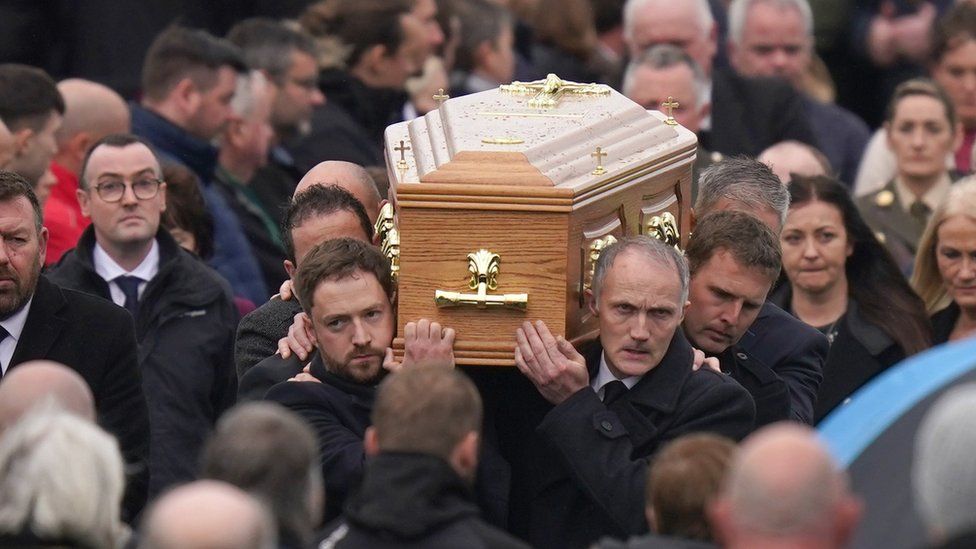 Mourners carrying the coffin of Martin McGill outside St Michael's Church, Creeslough, following his funeral