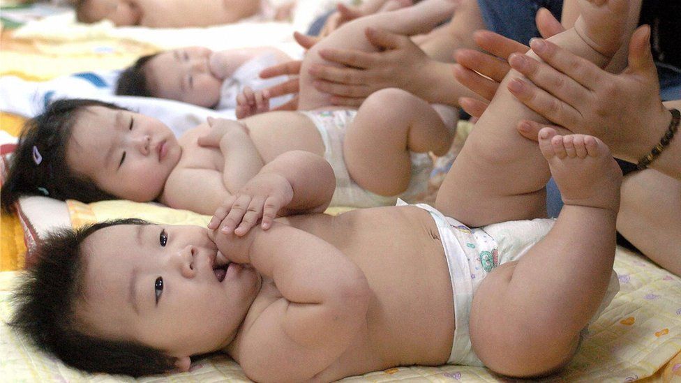 S Korean mothers massage babies