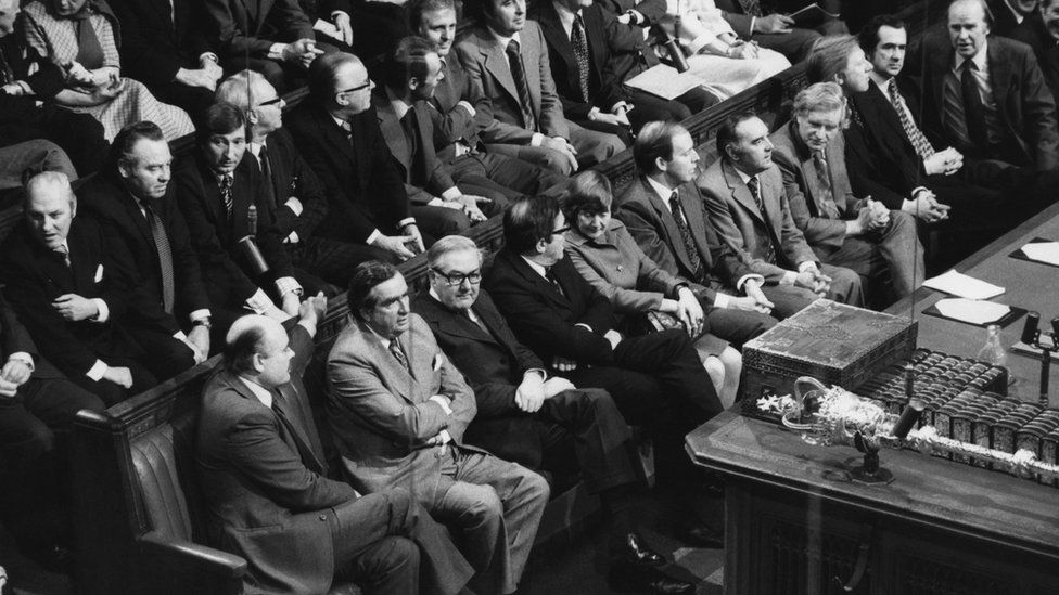 British Chancellor of the Exchequer Dennis Healey and Prime Minister James Callaghan on the front bench (second and third from left) at the House of Commons, London, 24th November 1976.