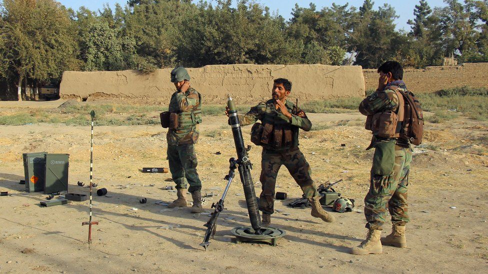 Afghan National Army (ANA) soldiers fire a mortar round at Taliban positions during a battle with Taliban in Kunduz provice, Afghanistan October 8, 2016.