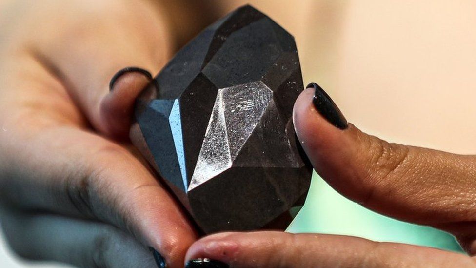 Diamond shown in someone's hands