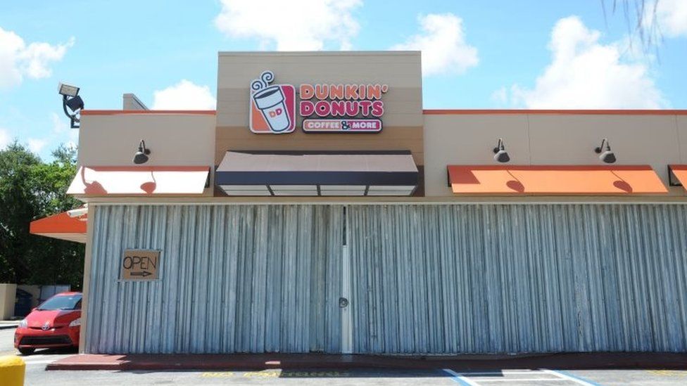 A Dunkin" Donuts shop is boarded as preparations are underway for the arrival of Hurricane Irma, September 7, 2017 in Fort Lauderdale,
