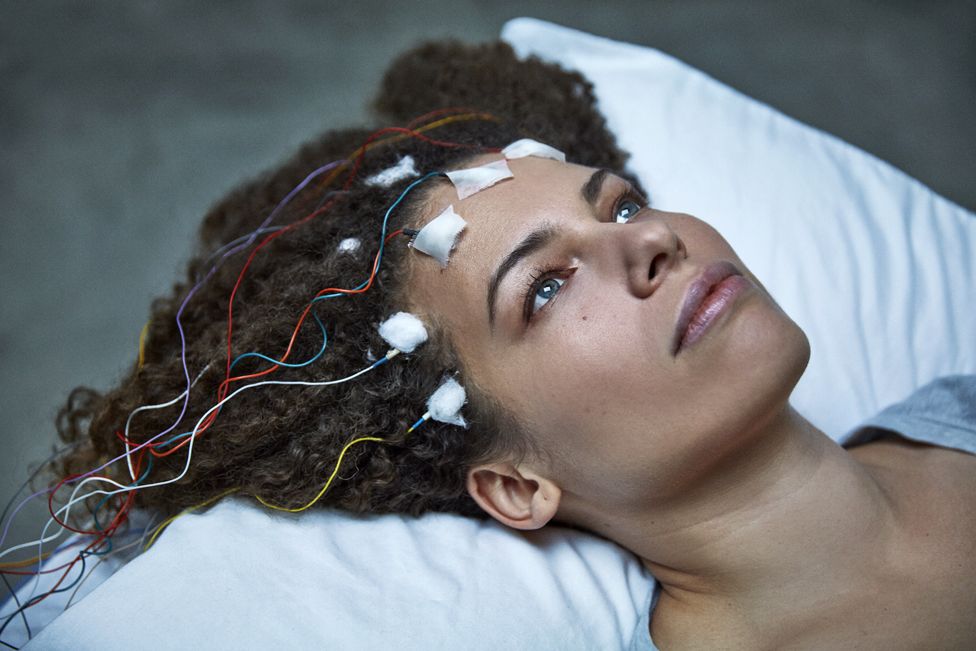 Jennifer Brea with electrodes attached to her head