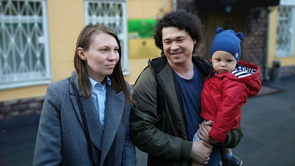 Olga and Dmitry Prokazov and their one-year-old son