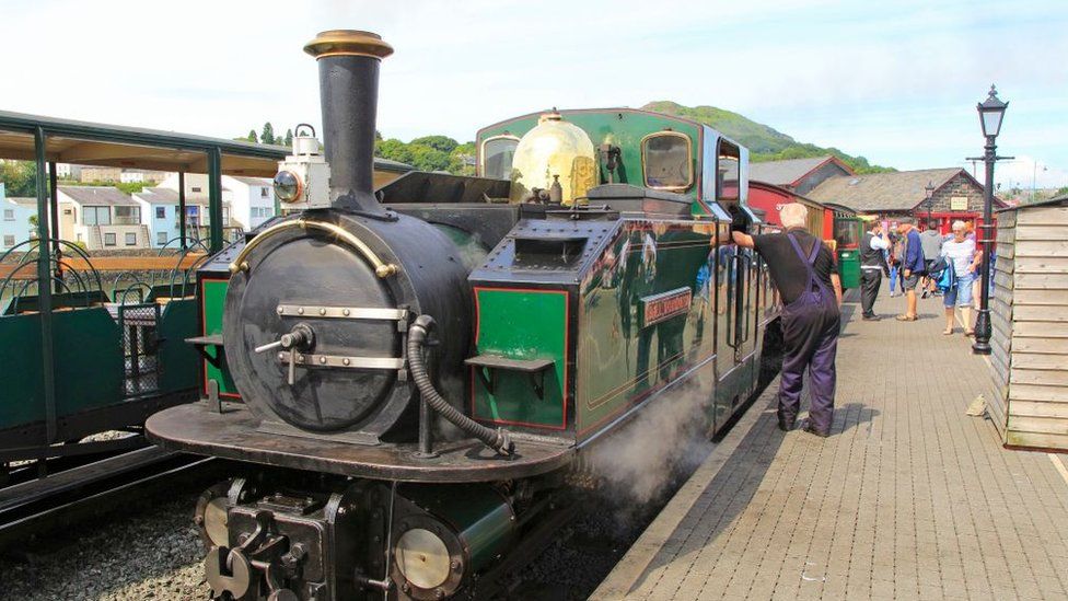 A steam train at Porthmadog Harbour station