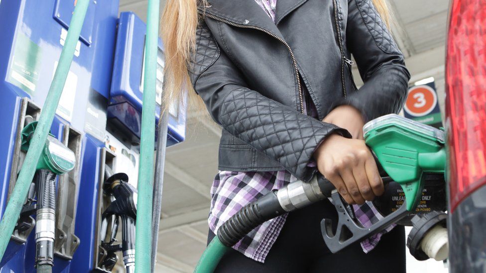 Woman at petrol pump