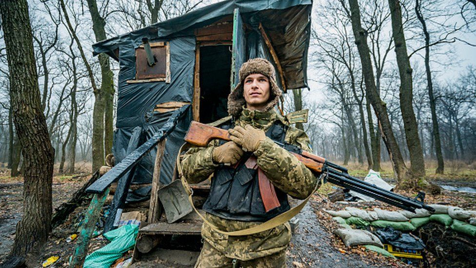 An Ukrainian soldier with his weapon