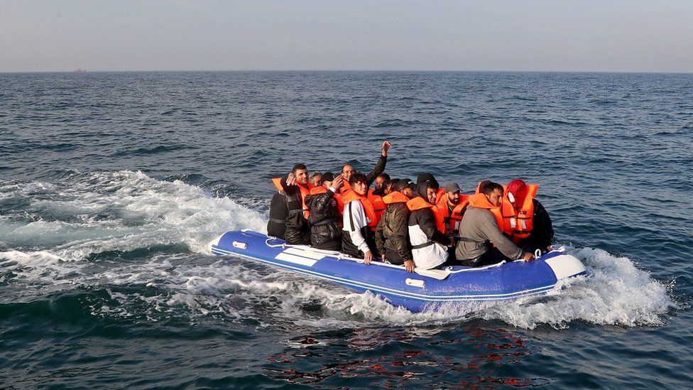 A group of people thought to be migrants crossing the Channel in a small boat headed in the direction of Dover, Kent.