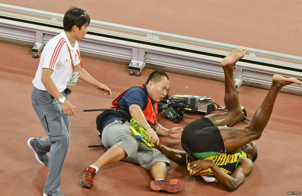 Usain Bolt is floored by a cameraman on a segway