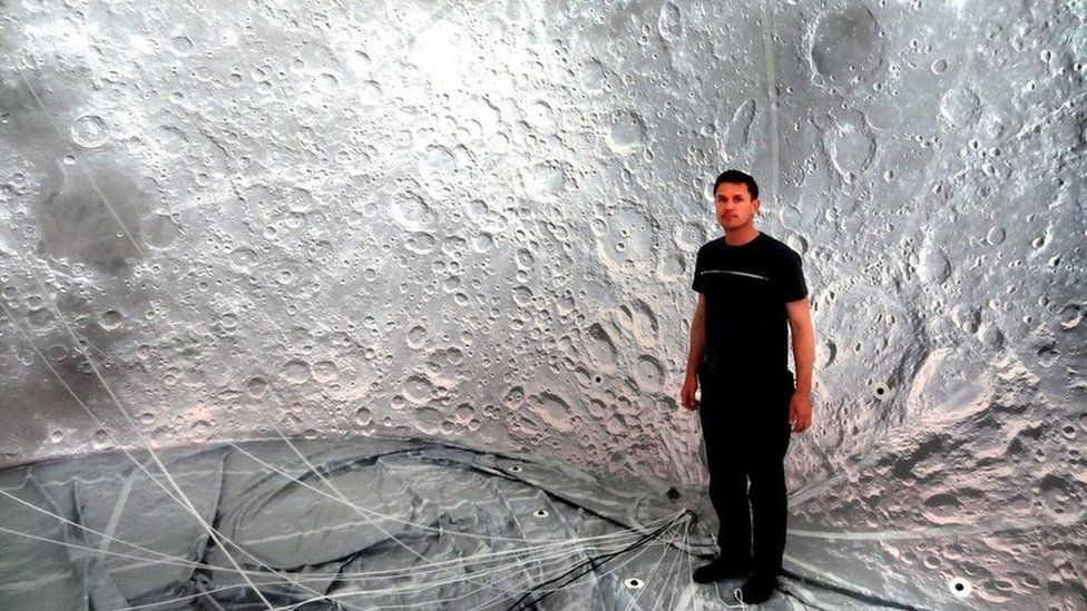 Artist Luke Jerram inside the moon balloon