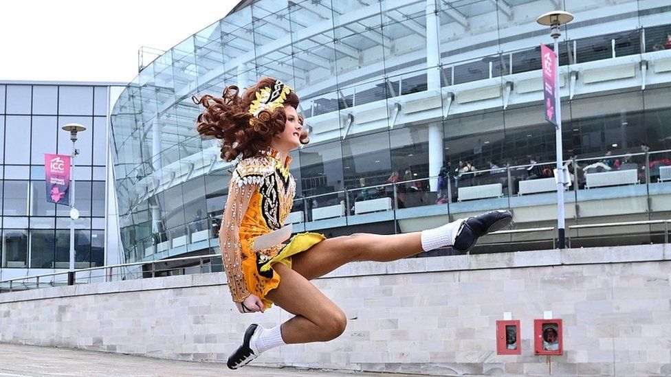 A dancer in front of Waterfront Hall in Belfast