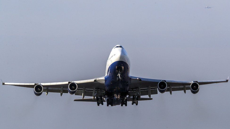 A passenger jet is pictured taking off from Heathrow Airport