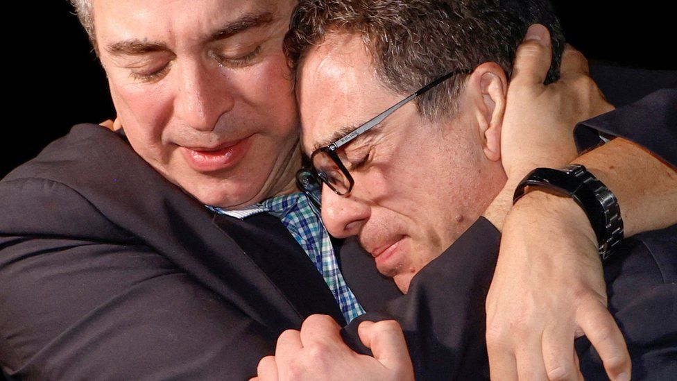 A family member embraces freed American Siamak Namazi after he and four fellow detainees were released in a prisoner swap deal between U.S and Iran, and arrived at Davison Army Airfield at Fort Belvoir, Virginia, U.S