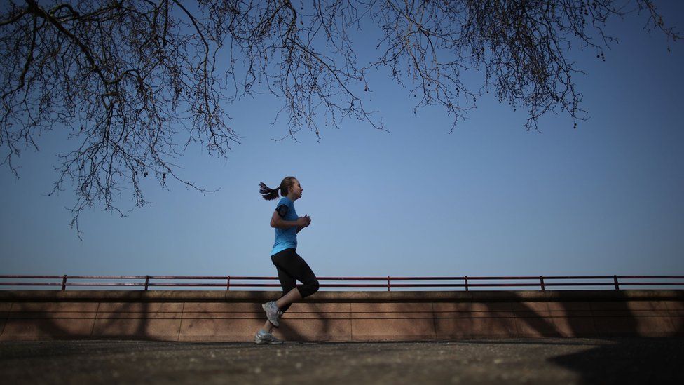 Stock photo of woman jogging in London