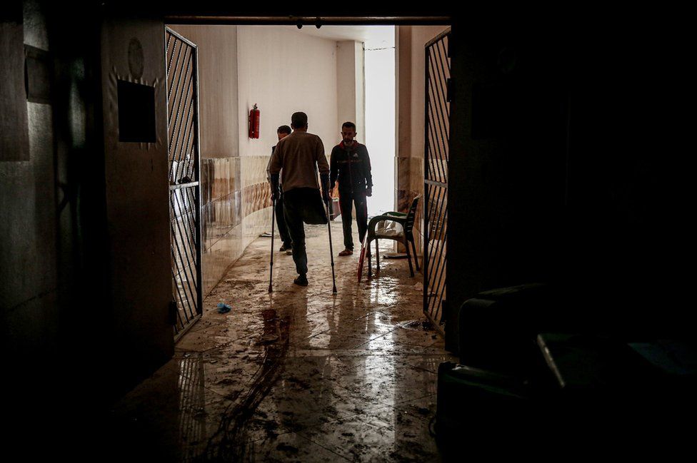 Syrians inspect damage inside a hospital in Atarib district in Idlib de-escalation zone, western Aleppo, Syria on 22 March 22 2021