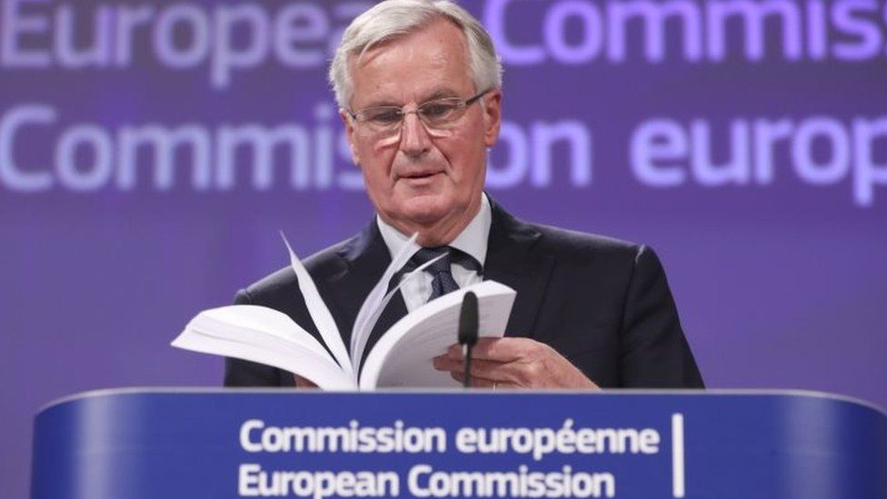 Michel Barnier with the draft Brexit agreement
