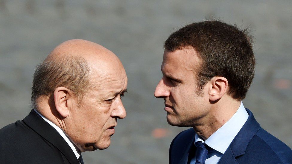 Mr Le Drian (R) and Mr Macron served together under President Francois Hollande