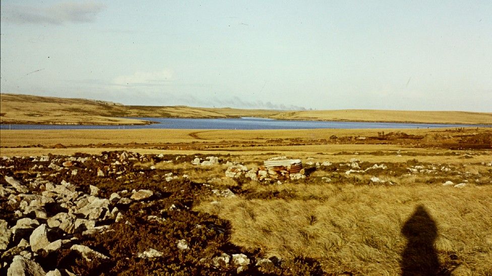 Falklands landscape with smoke in the distance