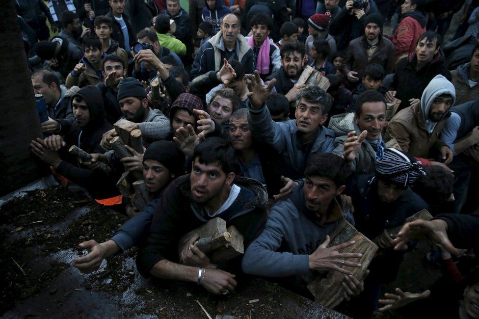 Migrants scuffle over firewood near Greece's Idomeni border crossing with Macedonia, 6 March