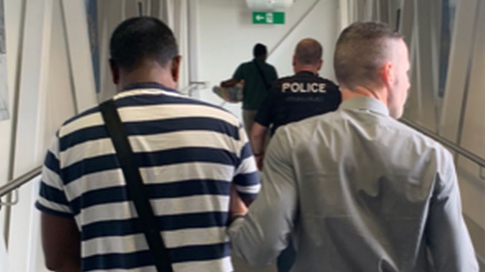 Kinane post arrest at London Gatwick airport on 8/8/19