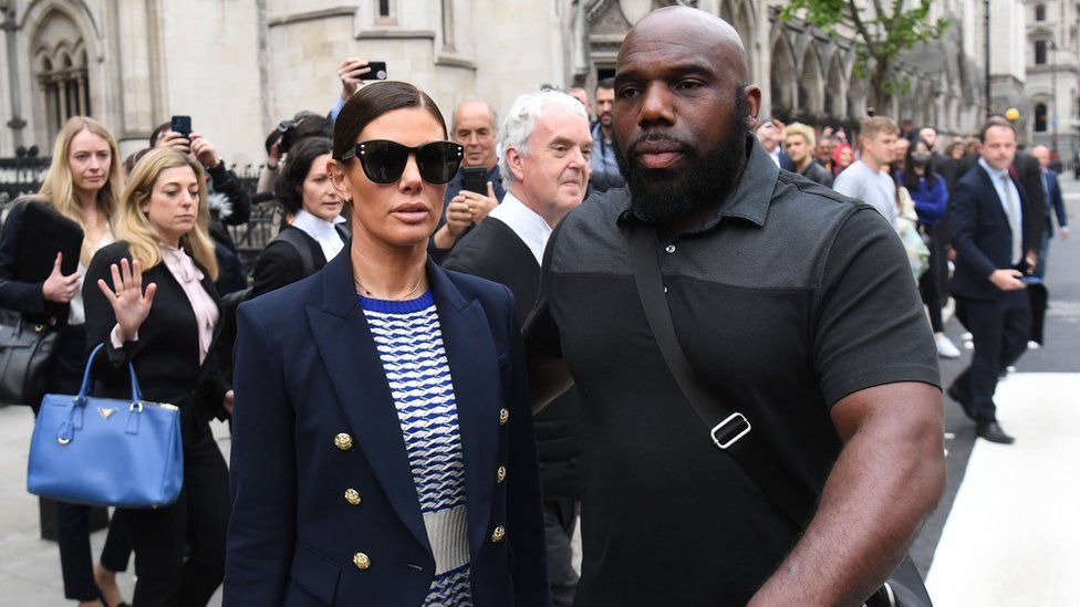 Rebekah Vardy and her security guard at the High Court