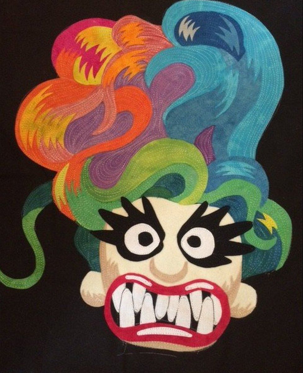A quilt made by the artist Frank Palmer which depicts as nightmarish version of a popular kids toy, a troll.