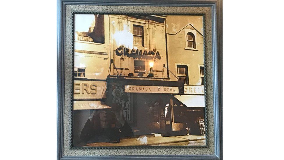 Framed photos of the Granada Cinema