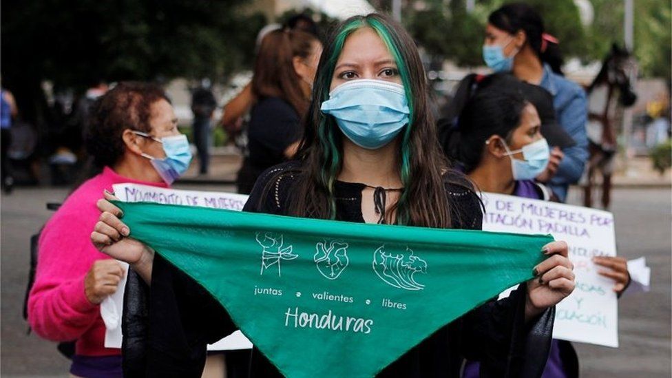 A woman holds a green handkerchief during a demonstration in favour of legalising abortion, after lawmakers approved a constitutional reform that would reinforce the ban, near the Congress in Tegucigalpa, Honduras January 25, 2021