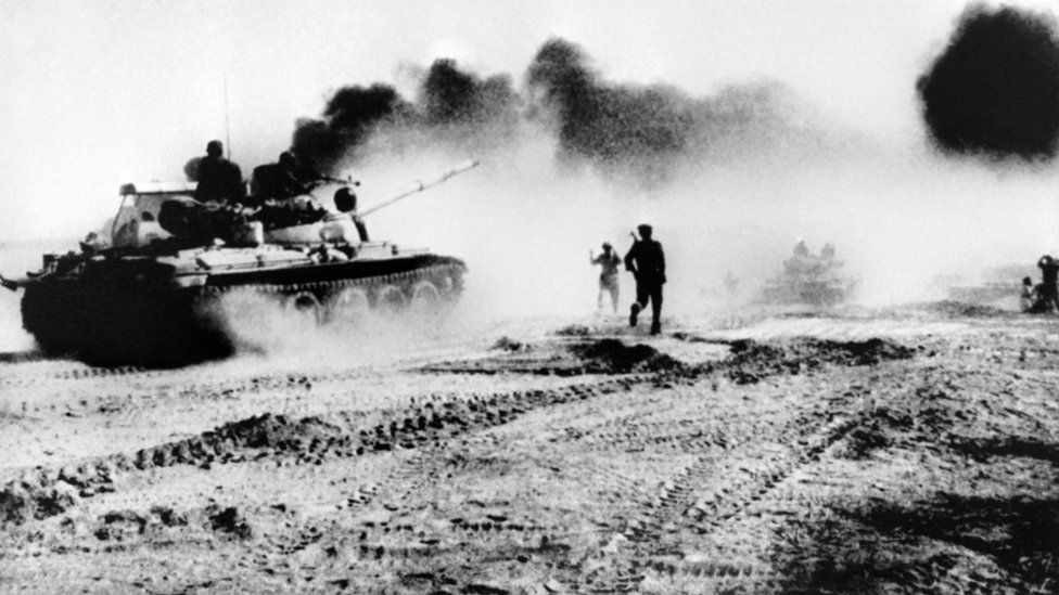 Iraqi troops riding in Soviet-made tanks trying to cross the Karun river. north-east of Khorramshahr in Iraq, during the Iran-Iraq war