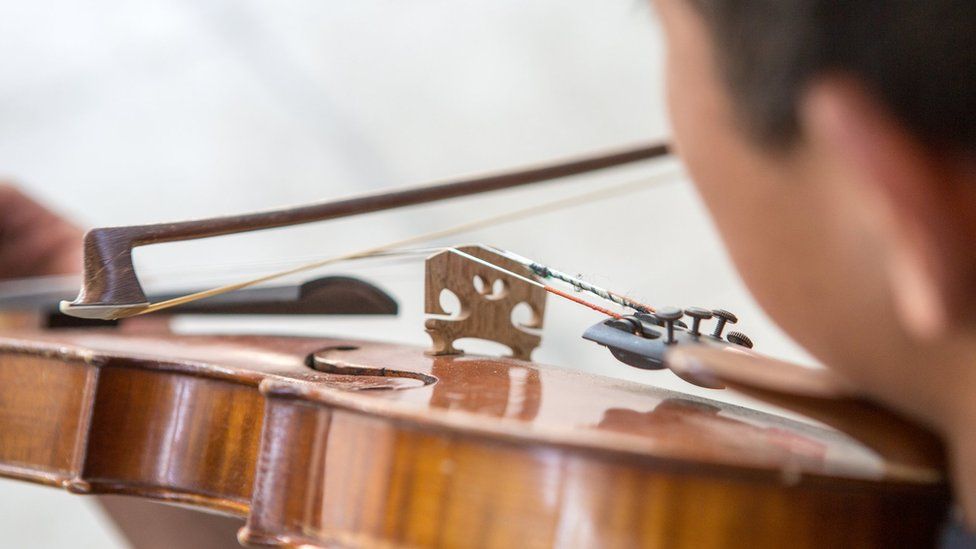 Child playing the violin