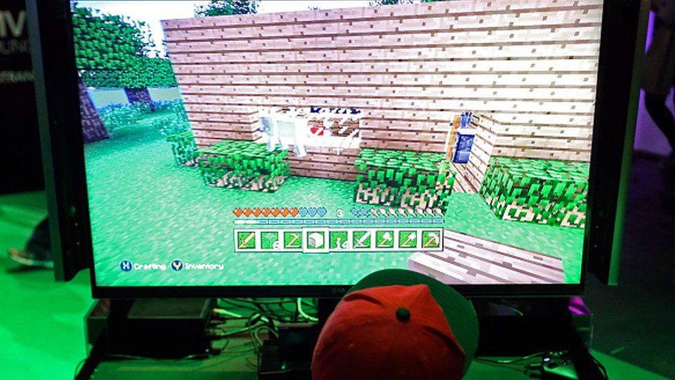 Boy playing hot sale minecraft