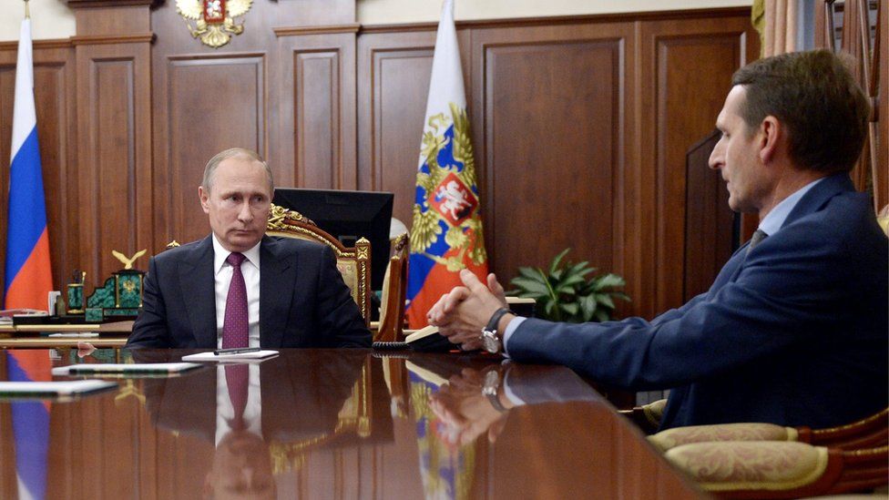 Russian President Vladimir Putin (C), meets in the Kremlin with State Duma Speaker Sergei Naryshkin (R)