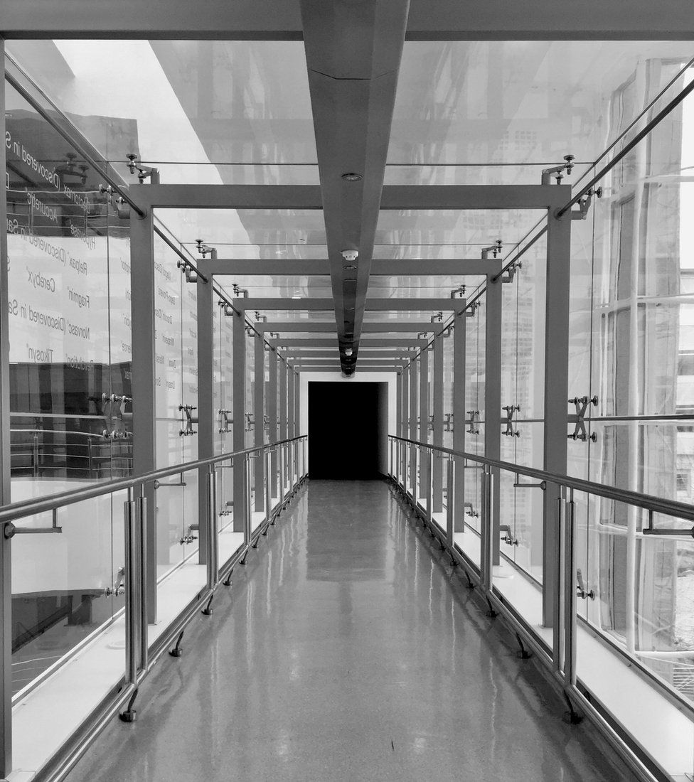 Black and white photograph of a corridor