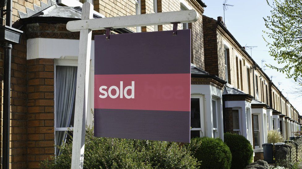 A sold sign outside a house