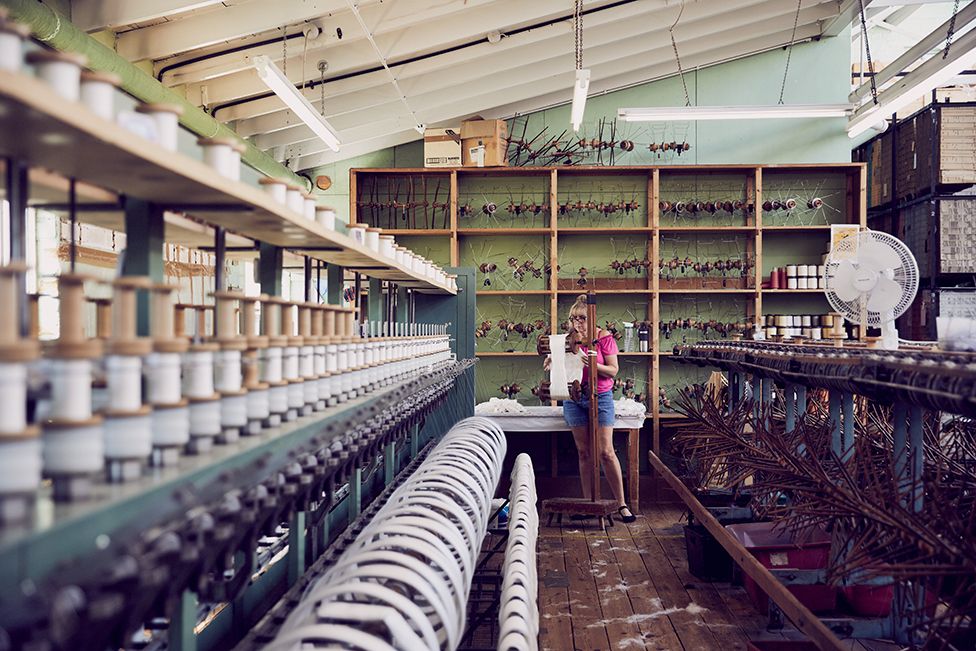 A woman stands in Gainsborough Mill