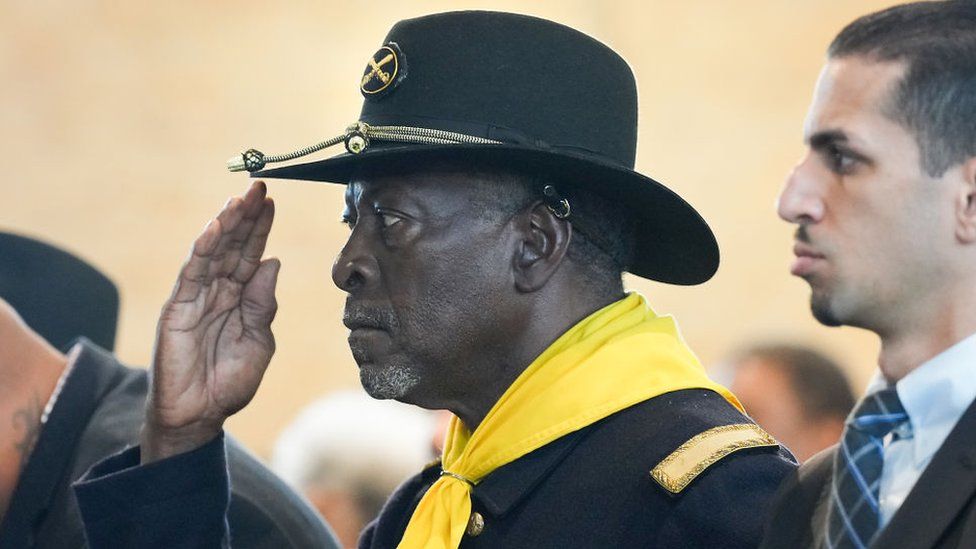 A Buffalo Soldier salutes during the singing of the National Anthem before an event recognizing the legacy of the soldiers from the 3rd Battalion, 24th Infantry Regiment, at Buffalo Soldiers Museum on Monday, Nov. 13, 2023 in Houston.