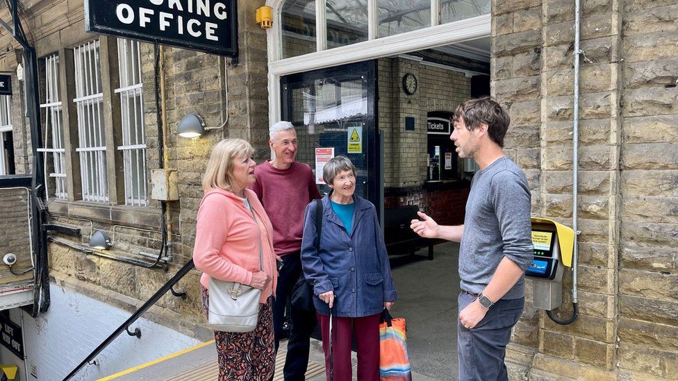 Scott Patient speaking to passengers about the proposed closures at Hebden Bridge Rail Station