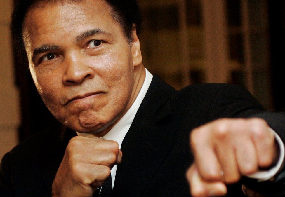 Muhammad Ali with fists in the air
