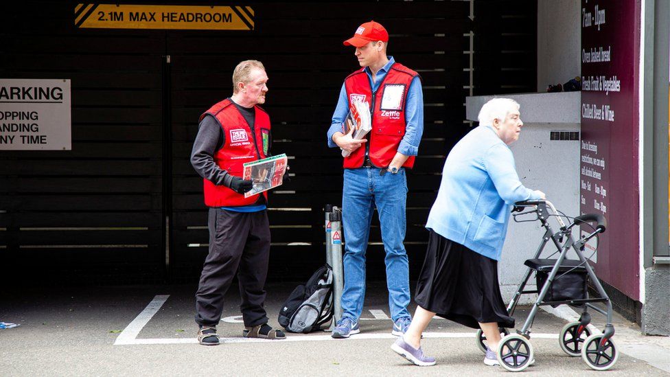 Prince William chatting to Dave Martin while selling The Big Issue